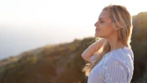 smiling woman in the mountains-starting a new life alone blog