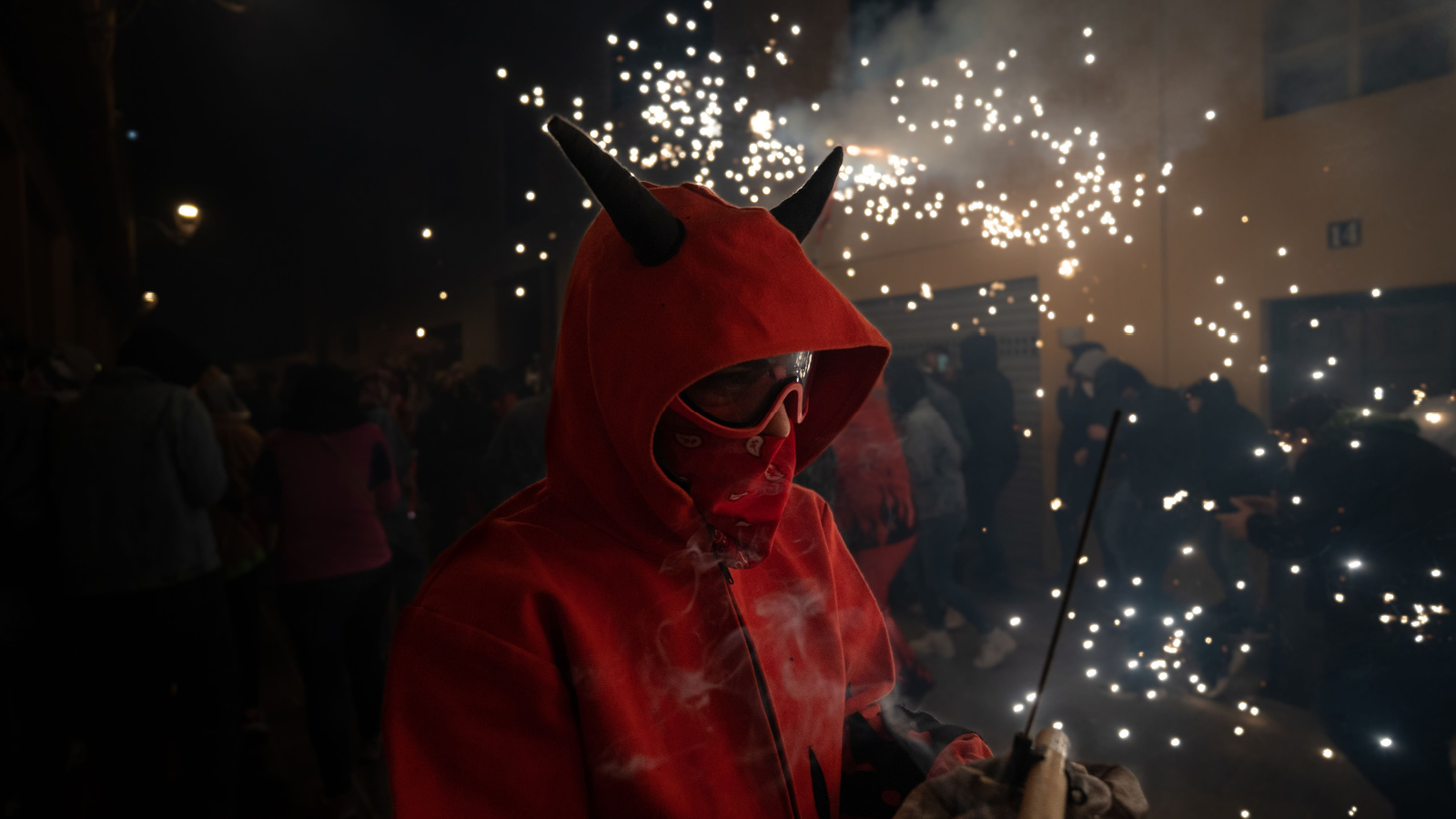 men dressed as devils