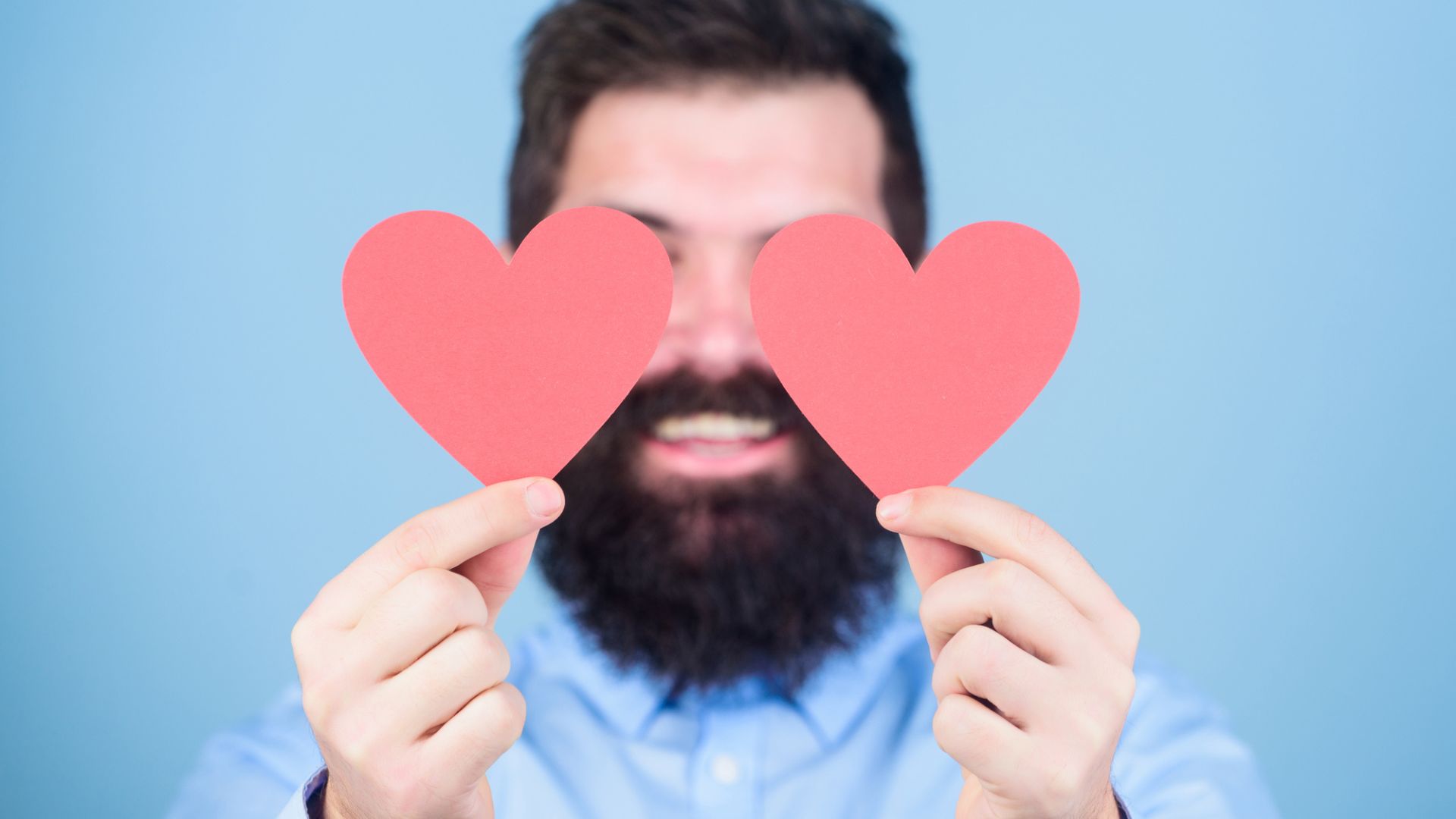 man with two hearts in front of his face, love, hearts, man