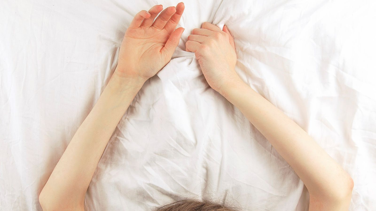 woman in bed with arms up, sex, faceless woman