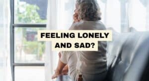 FEELING LONELY AND SAD WOMAN AT WINDOW
