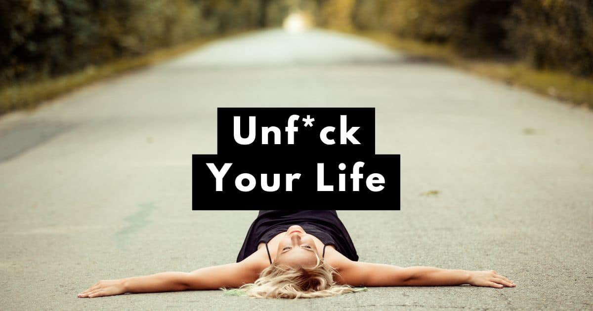 feeling stuck in life woman laying in the middle of the road