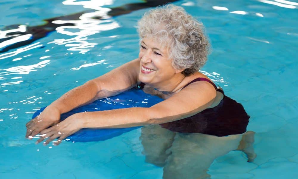 exercises for stiff joints woman swimming in pool
