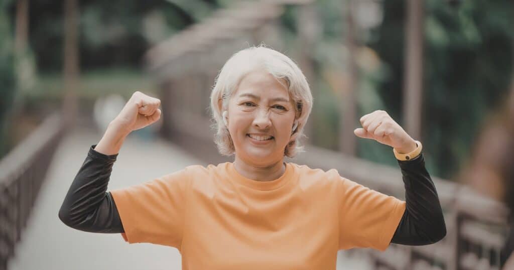 age strong and healthy smiling woman over 60