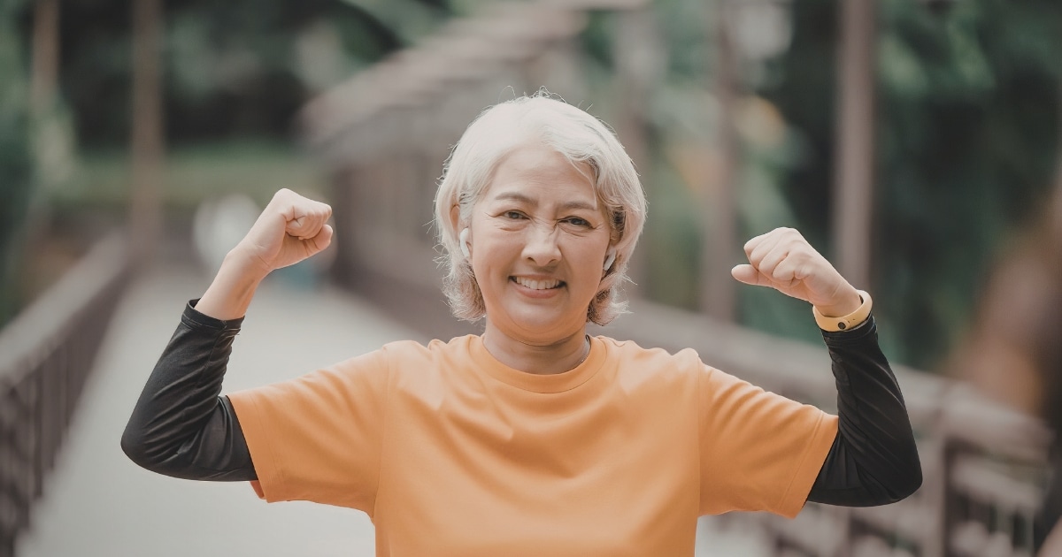 age strong and healthy smiling woman over 60