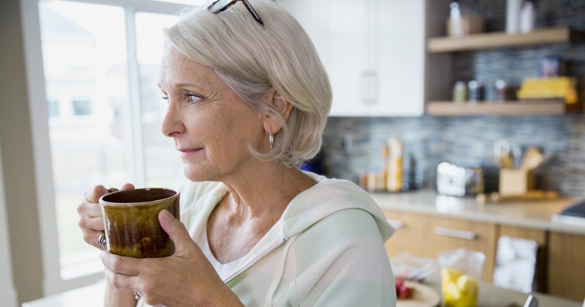 improve balance woman drinking coffee